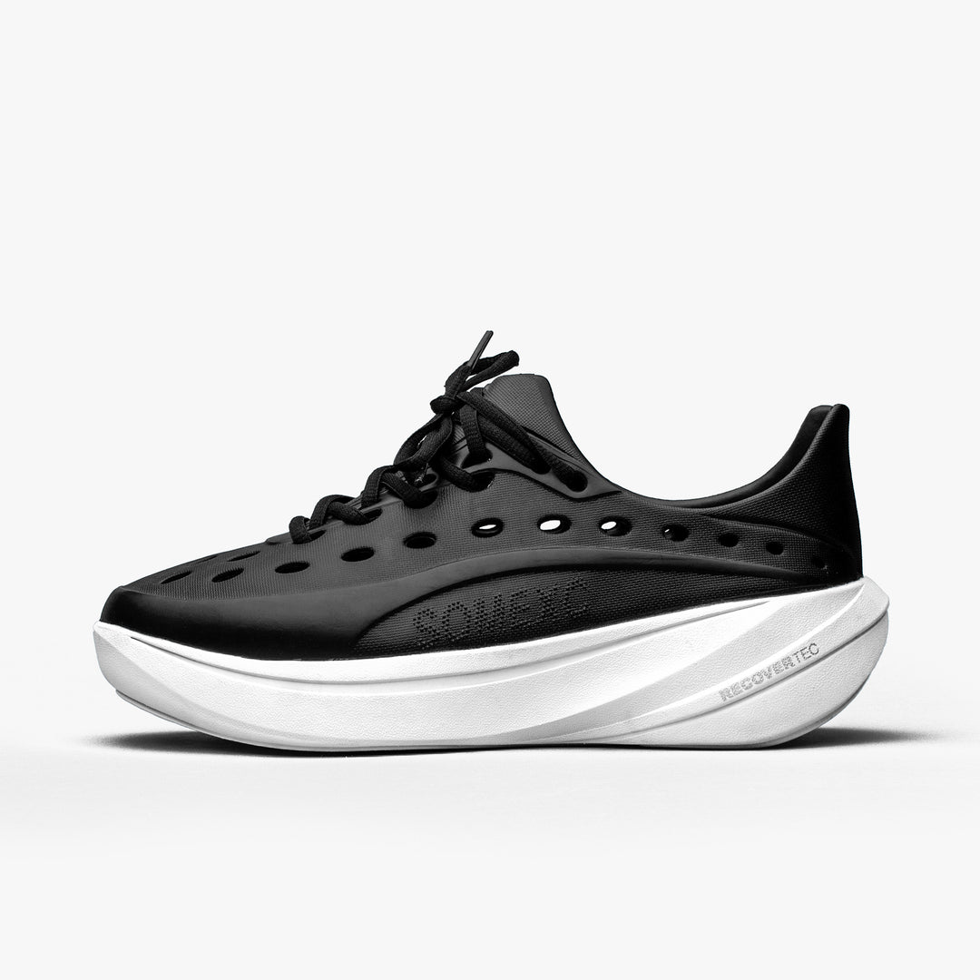 Lateral view of black/white Somexc recovery sneaker#color_black