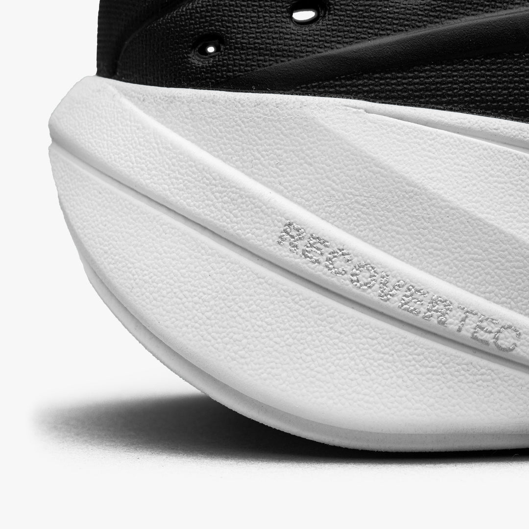 Text on outsole labeled "recovertec" on black/white Somexc recovery sneaker#color_white