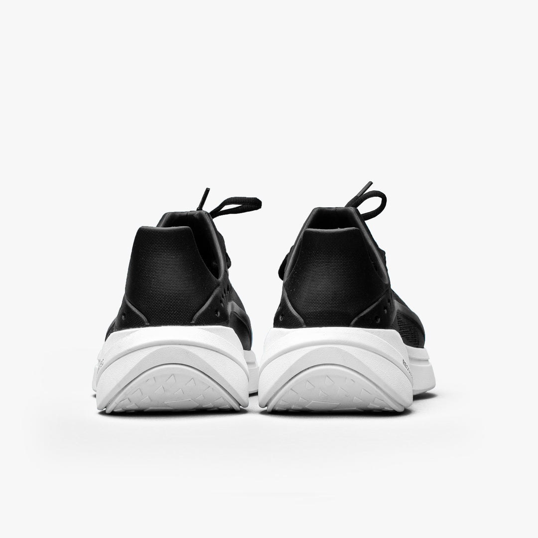 Heel view of black/white Somexc recovery sneaker#color_black